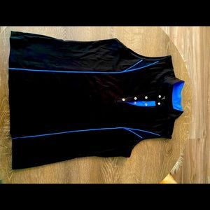 Tail, black with blue accents, golf shirt.